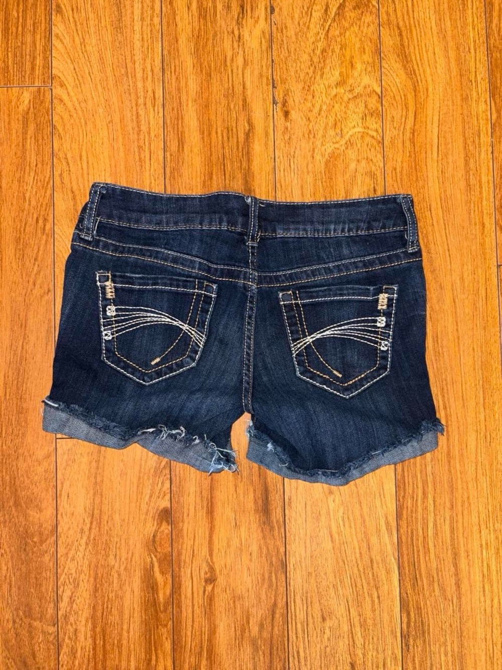 Y2K low rise navy blue denim shorts with a embroidered design